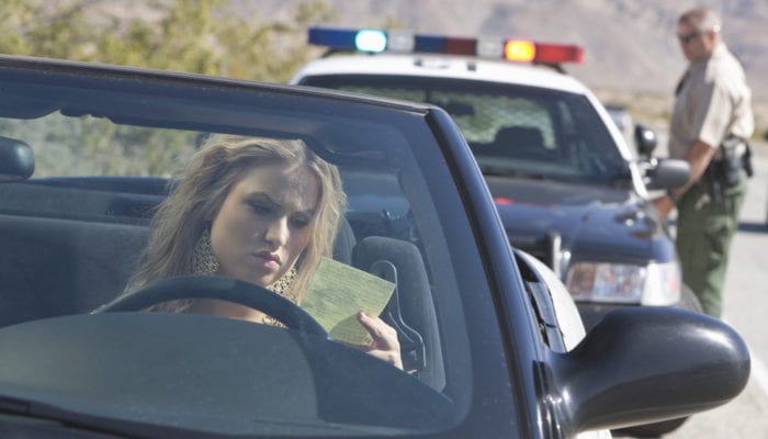 photo of a person being pulled over by the police. time for a Traffic Ticket Lawyer