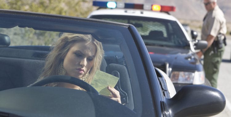 photo of a person being pulled over by the police. time for a Traffic Ticket Lawyer
